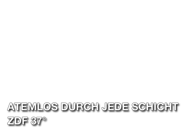 Pfleger mit Maske auf Frühgeborenen-Station